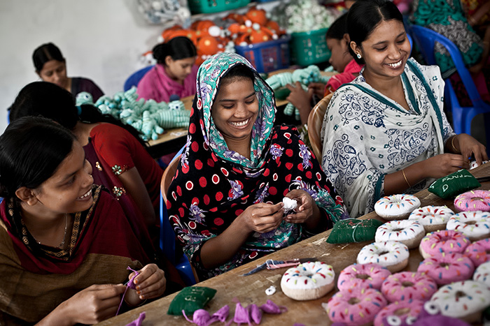 Young women in Bangladesh knitting for company Pebble, Packed with Purpose Impact Partners.