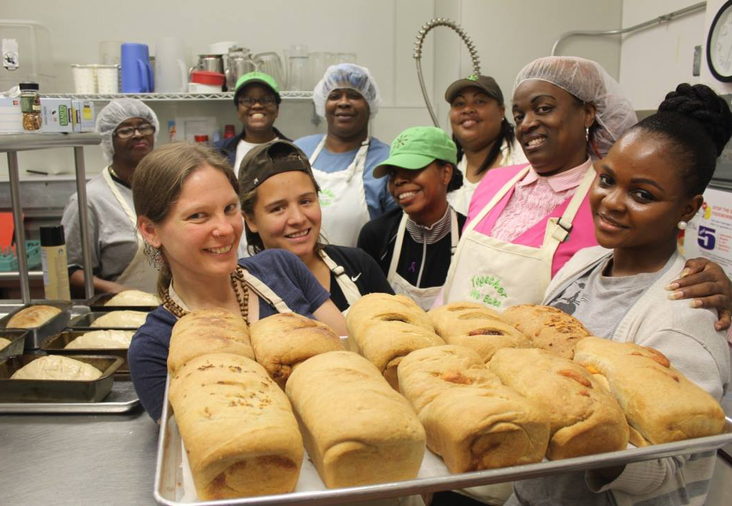 Women from Together We Bake while baking. Packed with Purpose Impact Partners.