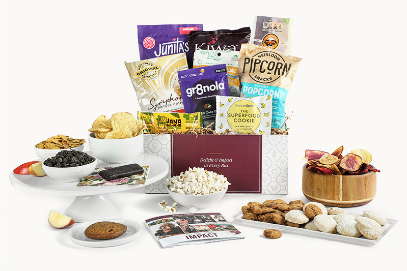 Celebrate and Elevate gift box containing popcorn, cookies, crackers, chips, snack bars, impact booklet
