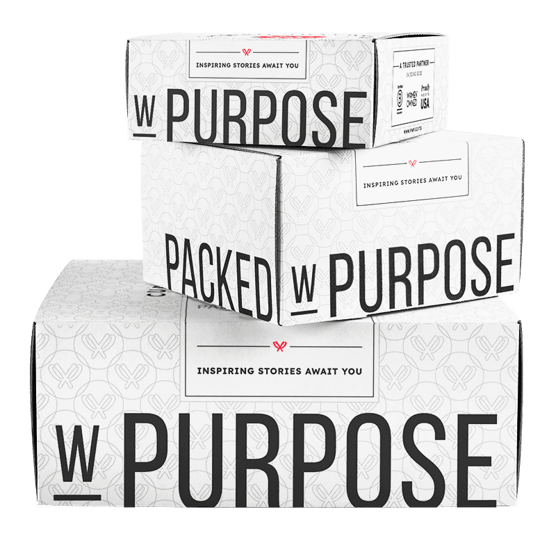 A Stack of Packed with Purpose gift boxes