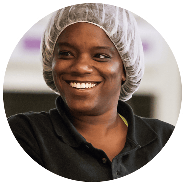 Smiling women making granola