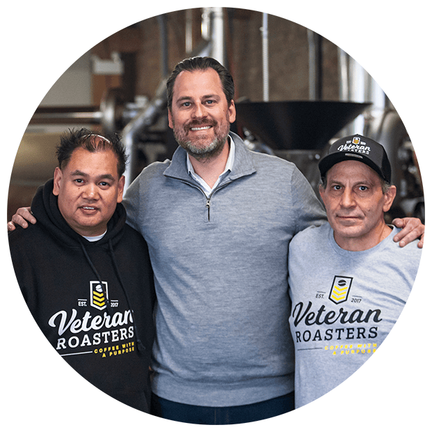 Smiling veterans in a coffee brewery