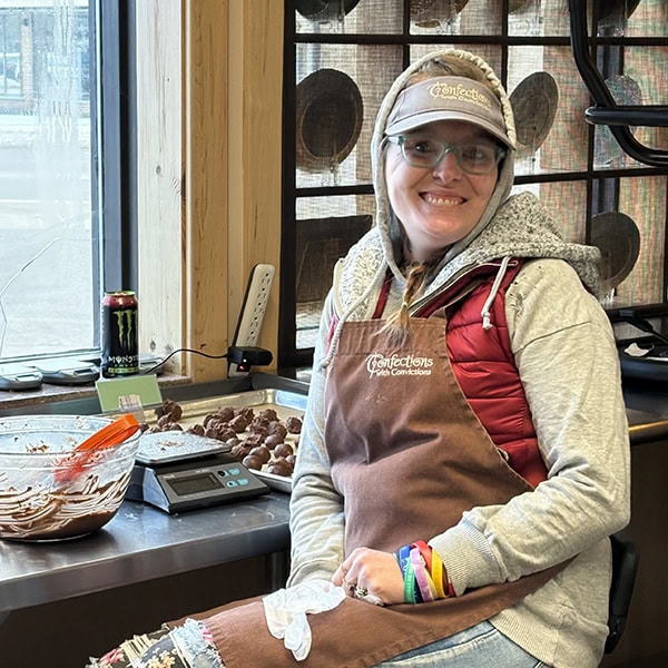 Smiling woman mixing chocolate