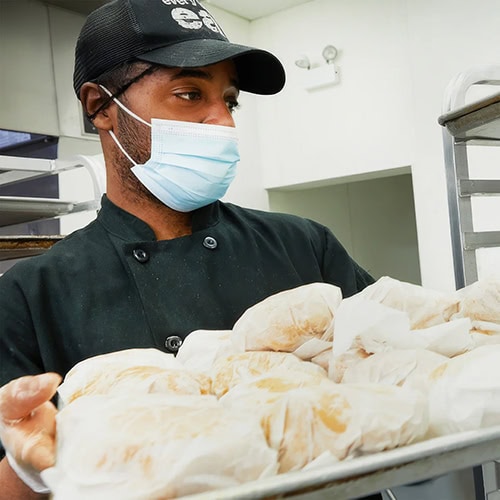 Man working in the Every Body Eat kitchen
