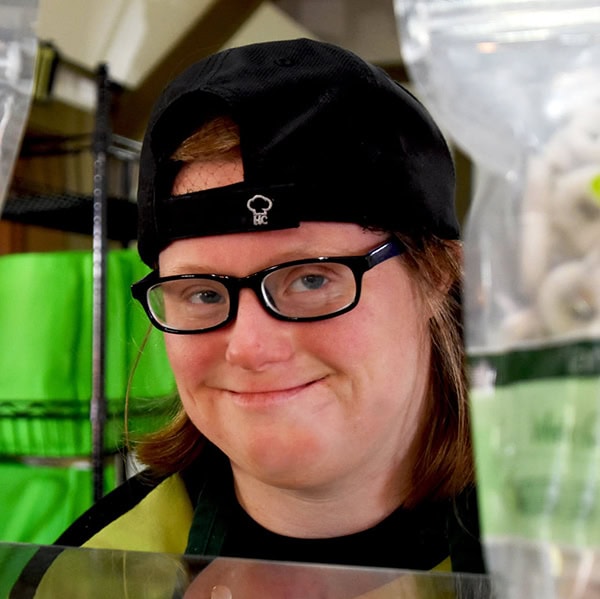 Smiling young women amongst Lambs Farm snacks