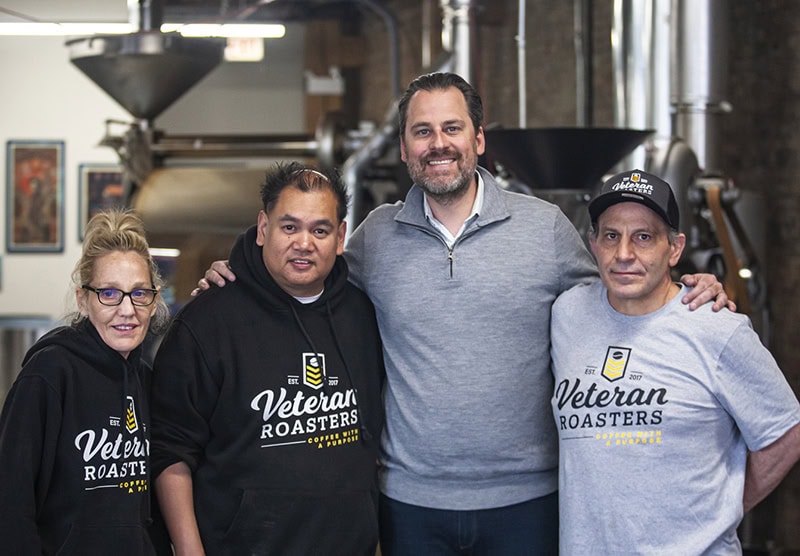 A group of workers at Veteran Roasters posing together