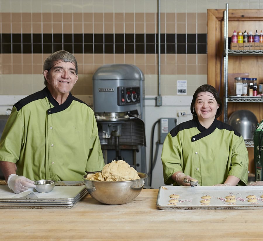 Smiling Lambs Farm program participants making sugar cookies