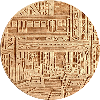 Coaster with laser etched artwork depicting a busy city street