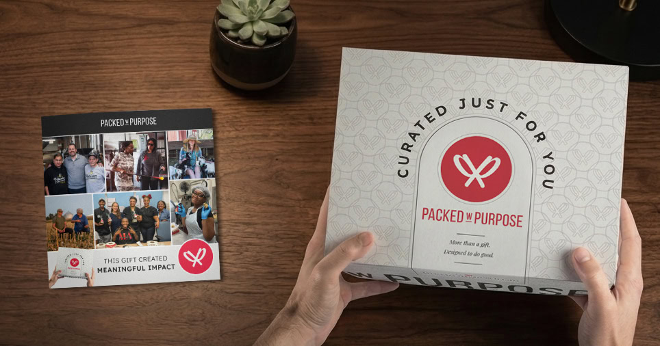 PwP gift box and Impact Booklet on a dark wood desktop