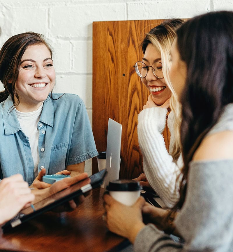 Employees smiling and interacting