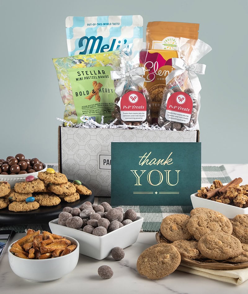 Packed with Purpose gift basket filled with chocolate almonds, cookies, pretzels, and more.
