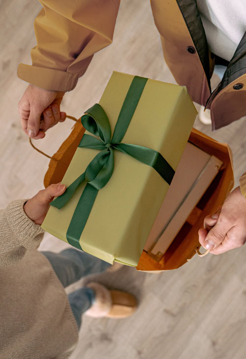 A gift being handed to a coworker
