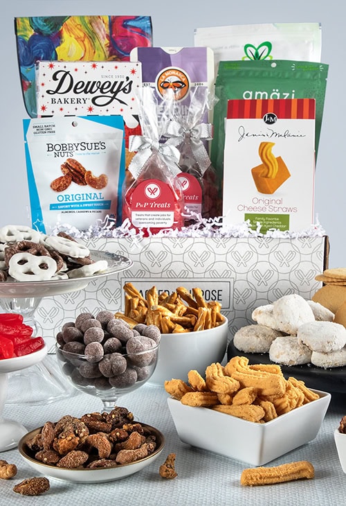 A Packed with Purpose gift box displaying an array of treats